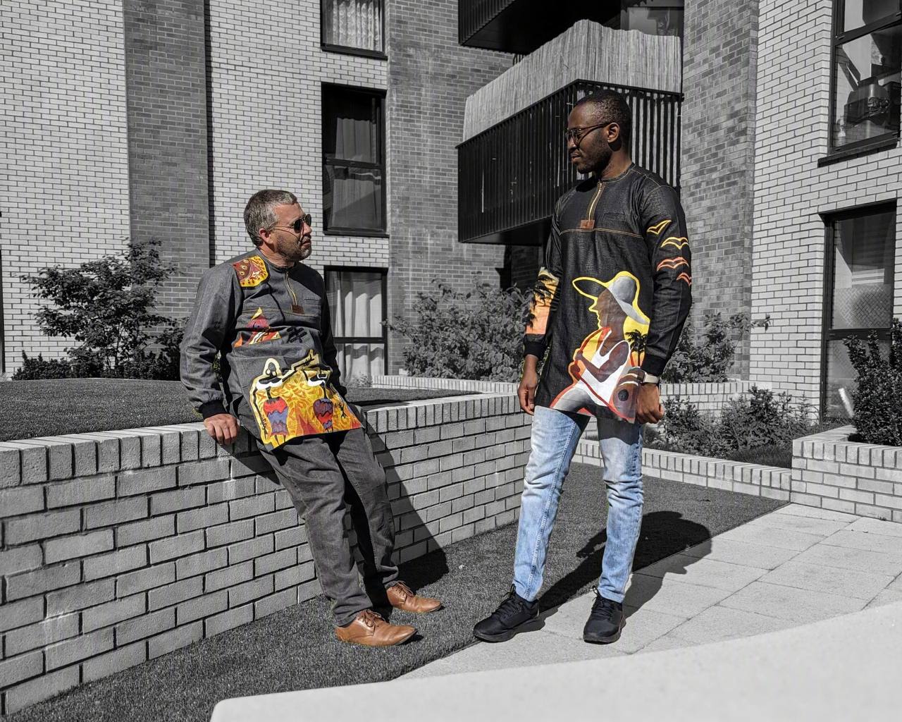Two men in printed Roweiz tops on a London street