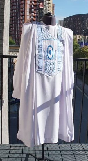 Bespoke White Agbada with Blue Embroidery for men on a mannequin - Roweiz London